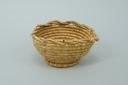 Image of coiled grass basket with scalloped edge